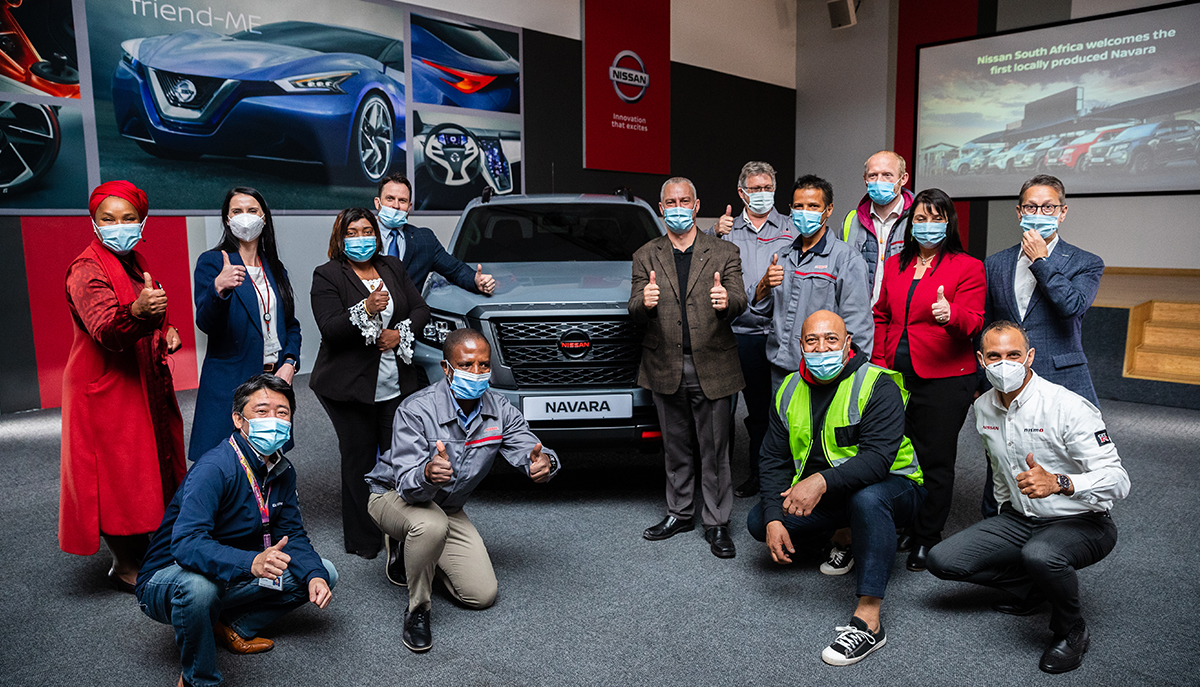 Nissan Team posing with the Nissan Navara